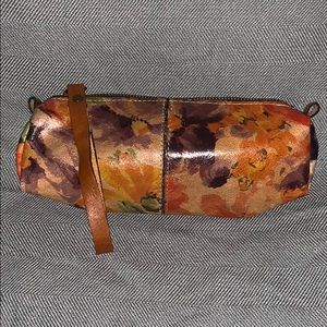 Leather floral print bag.